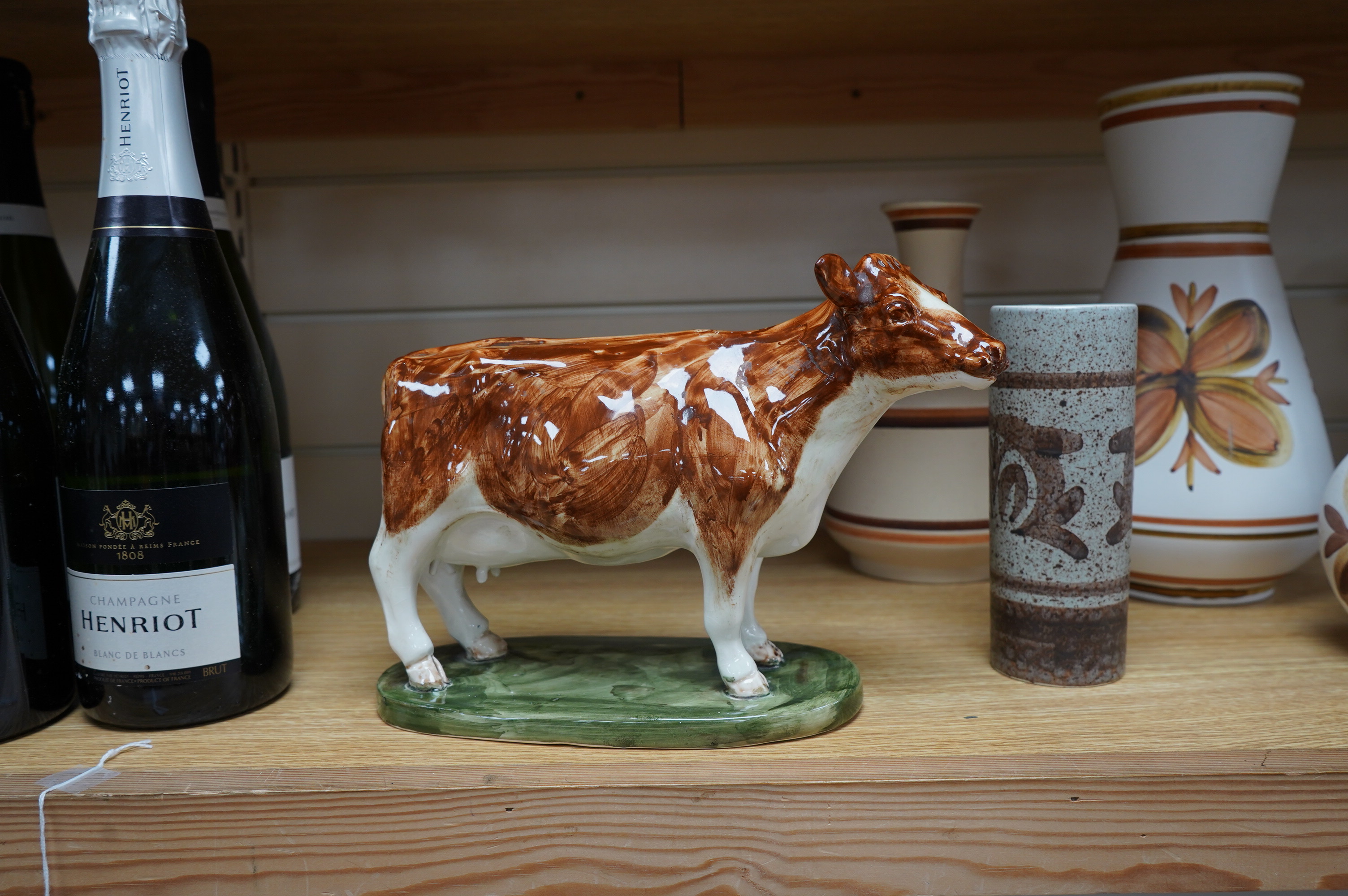 David Sharp, an Ayrshire cow produced for Bayer, and three Cinque Ports Rye vases and a carafe, largest 28cm high. Condition - good